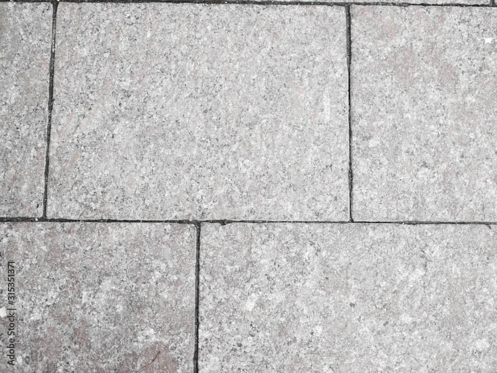 Naklejka premium gray tile closeup. Background from tiles. Background texture.