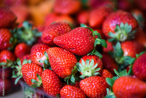 fresh strawberries close up within the fruits market in Prague