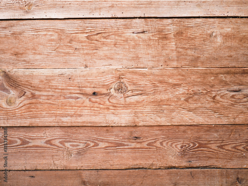 Naklejka premium Orange wooden background close-up. Background from wood tiles. Background texture.