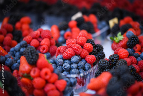 fresh berries close up - strawberries, blueberries, red berries, raspberry, black berries 