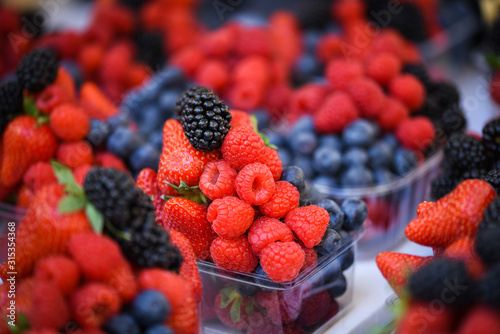 fresh berries close up - strawberries, blueberries, red berries, raspberry, black berries 
