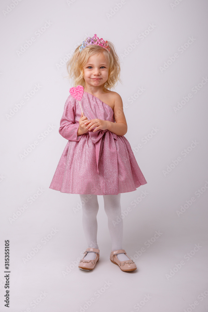 beautiful little blonde girl with a heart shaped Lollipop beautiful little blonde girl with a heart shaped Lollipop