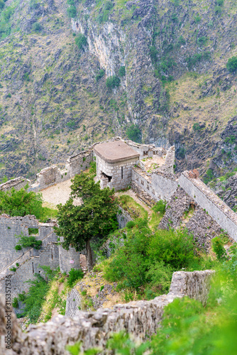 historical fortress in Montenegro on a mountain above the city and the sea. against the background of the Adriatic sea.