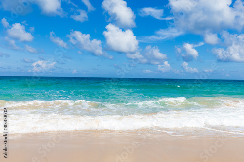White sand beach turquoise sea water against blue sky with cloud seascape vacation background © themorningglory
