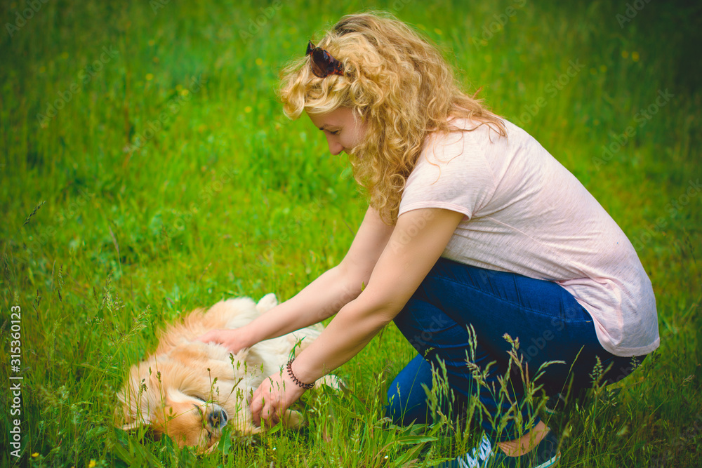Fototapeta premium Mature woman on a nature, relax time with a dog