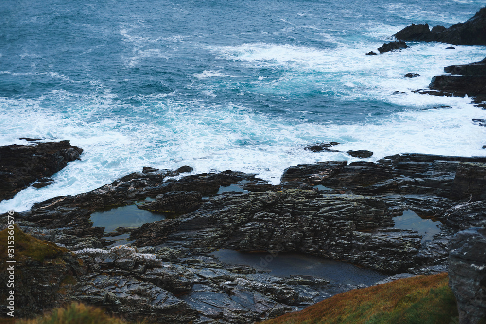 Fototapeta premium waves at rocke sea shore