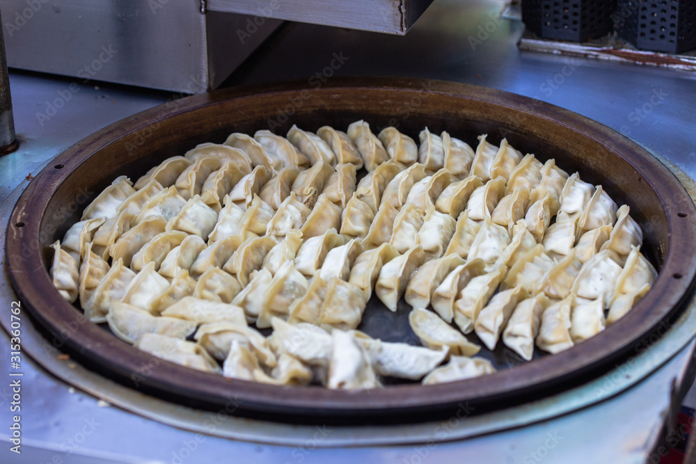 Pork and Cabbage Dumplings (Guotie or Jiaozi). Gyoza. Frying the