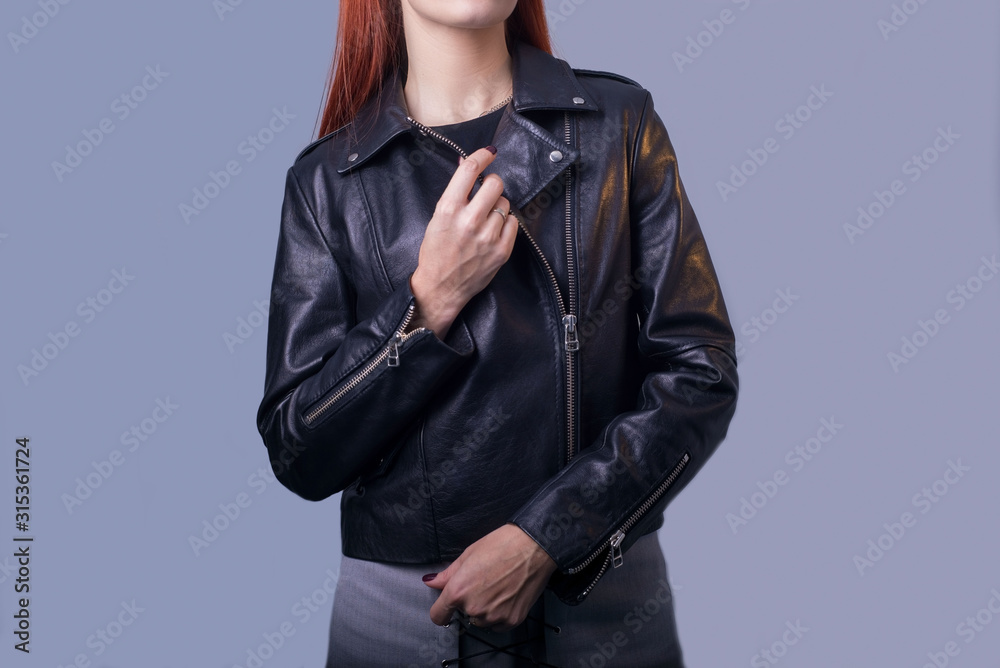 portrait of a girl in a high-quality leather jacket. Rock and roll style in  women. Promotional photo of a leather jacket Stock Photo | Adobe Stock