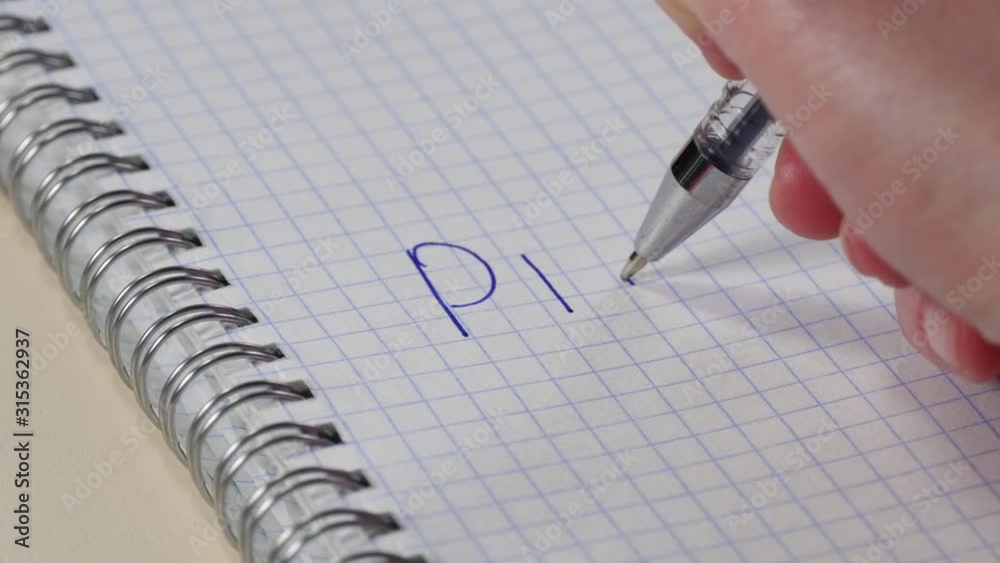 Female hand close-up writes on a piece of paper the word Plan. Female hand close-up writes on a piece of paper the word Plan.