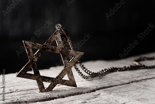 the star of david on a rustic wooden surface
