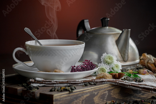 Tea hot drink on old background in composition on the table