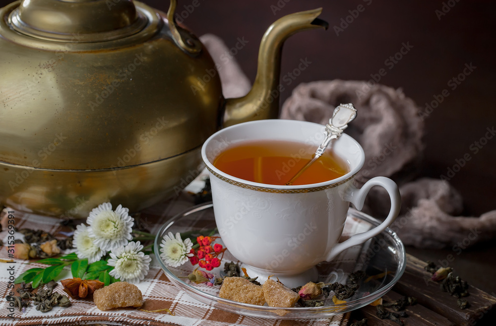 Tea in a cup on an old background Tea in a cup on an old background
