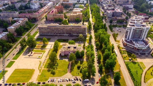 Aerial view of buildings and avenues of city downtown in summer
