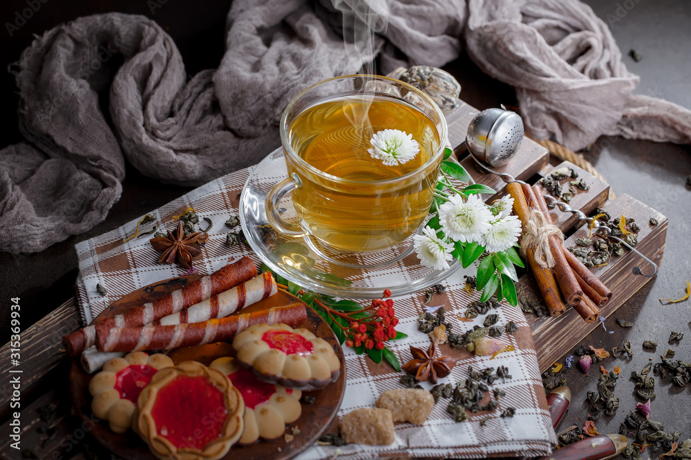 Tea hot drink on old background in composition on the table Tea hot drink on old background in composition on the table