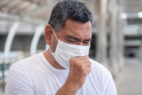 allergic sick old man coughing with sore throat; concept of man with allergy, phlegm, sore throat or throat inflammation, influenza, flu, cold, sickness, health care concept