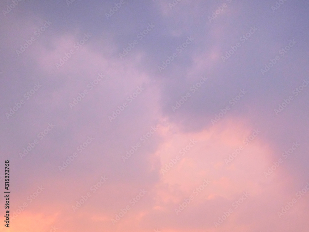 Pink clouds in the evening sky as a background.