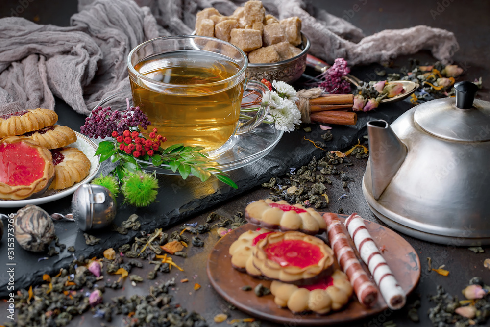 Tea hot drink on old background in composition on the table Tea hot drink on old background in composition on the table