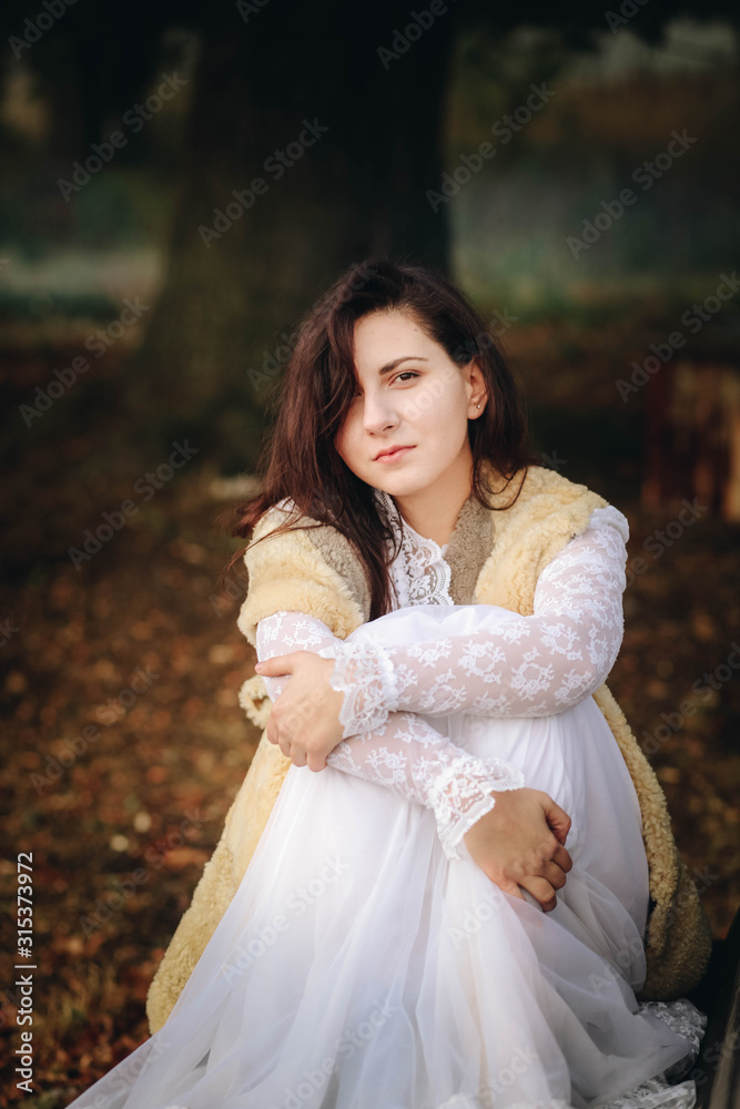 girl in a white dress on a mist field with oaks girl in a white dress on a mist field with oaks