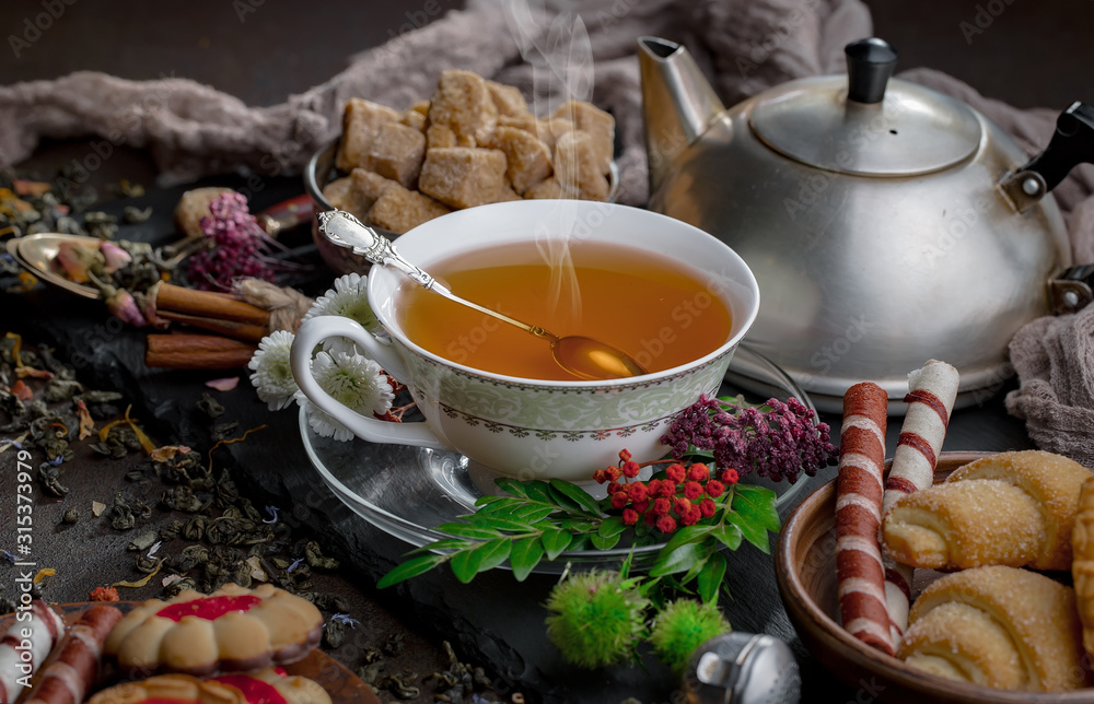 Tea hot drink on old background in composition on the table Tea hot drink on old background in composition on the table
