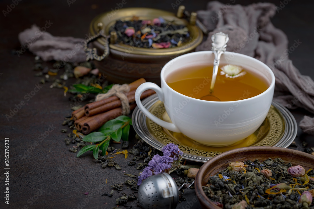 Tea hot drink on old background in composition on the table