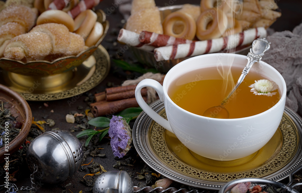 Tea hot drink on old background in composition on the table Tea hot drink on old background in composition on the table