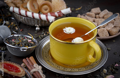 Tea hot drink on old background in composition on the table