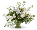Arrangement of white flowers in green vase