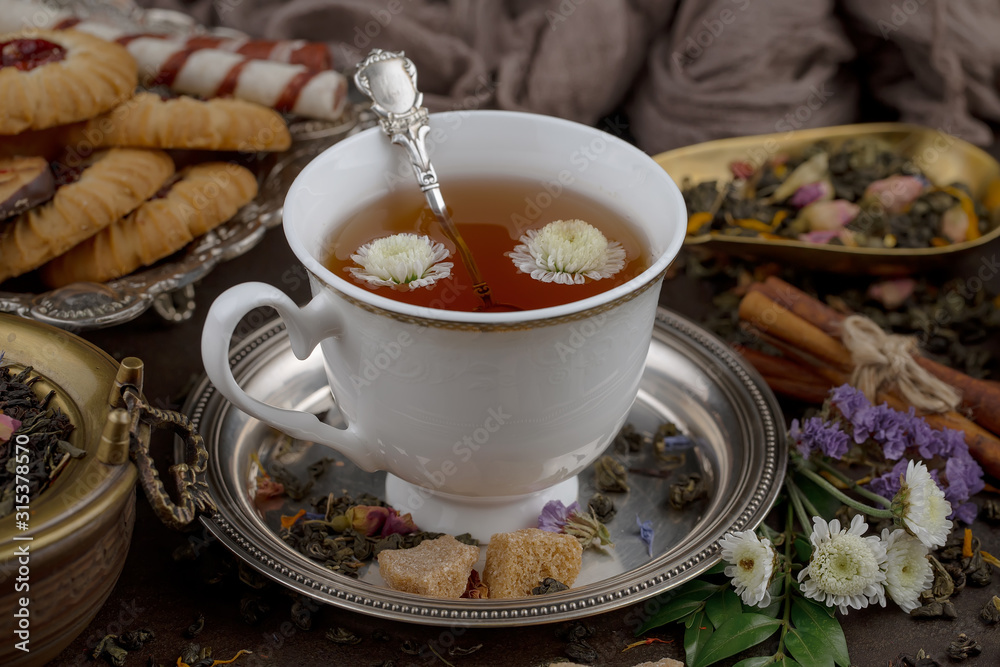 Tea hot drink on old background in composition on the table Tea hot drink on old background in composition on the table