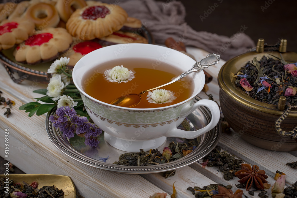 Tea hot drink on old background in composition on the table Tea hot drink on old background in composition on the table