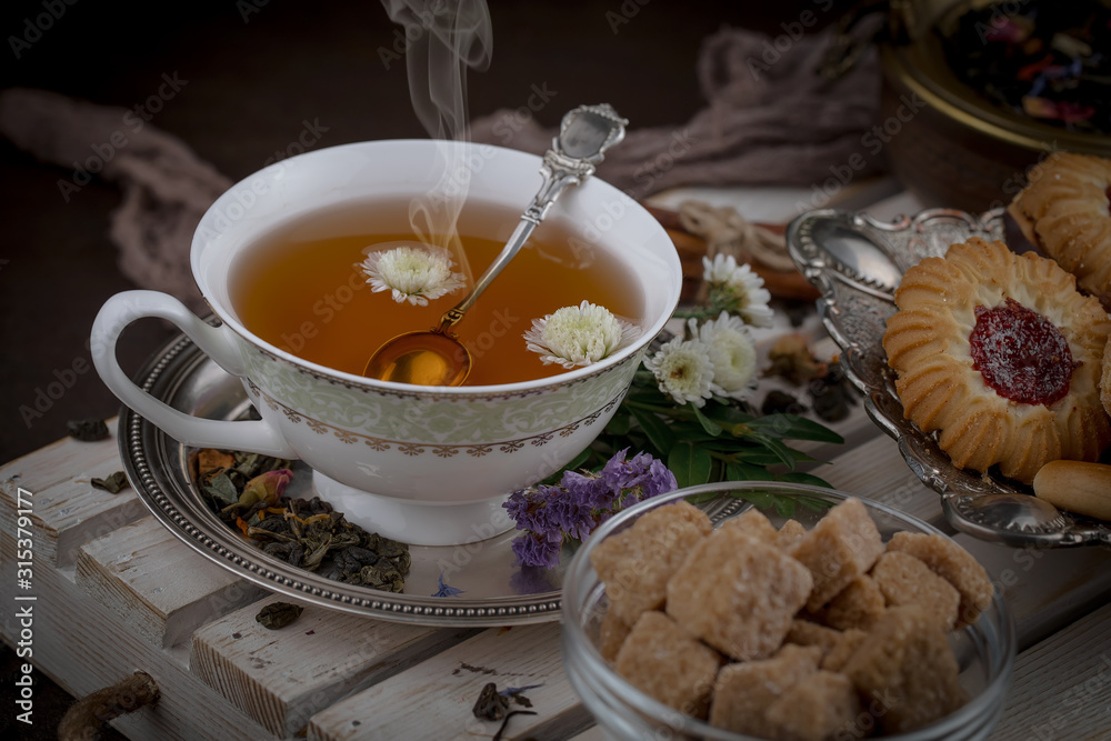Tea hot drink on old background in composition on the table Tea hot drink on old background in composition on the table