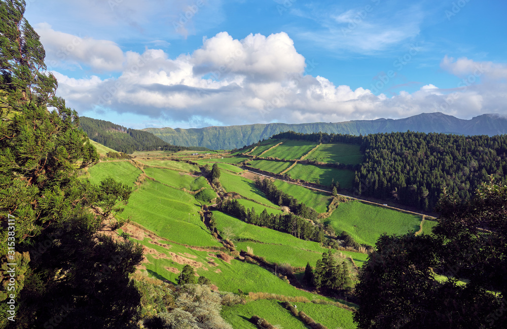 Mountain landscape with fields and forests on the Sao Miguel Island. Azores, Portugal.