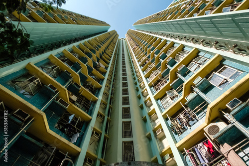 Photography looking up on high-rise apartment building, residential building facade, hongkon