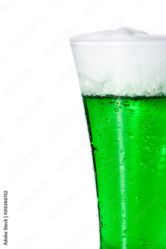 Traditional St Patrick's Day green beer isolated on white background. Copy space