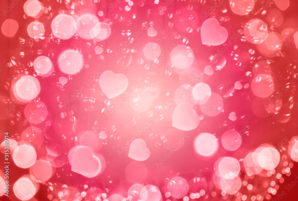 Defocused abstract red background with space for text. Blurred bokeh background of Valentine Day with hearts Defocused abstract red background with space for text. Blurred bokeh background of Valentine Day with hearts