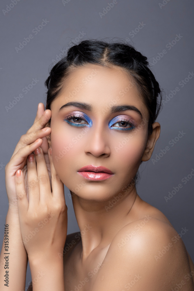 Closeup portrait of an Indian model with bold eye makeup and lipstick looking at camera. Makeup portrait for eye makeup and lipstick Closeup portrait of an Indian model with bold eye makeup and lipstick looking at camera. Makeup portrait for eye makeup and lipstick