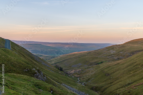 Driving on the Buttertubs Pass (Cliff Gate Rd) between Thwaite and Simonstone, North Yorkshire, England, UK