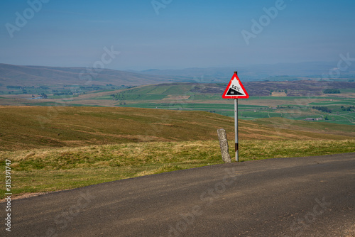 Sign: 14% descent, seen on the B6270 road between Birkdale and Nateby, Cumbria, England, UK