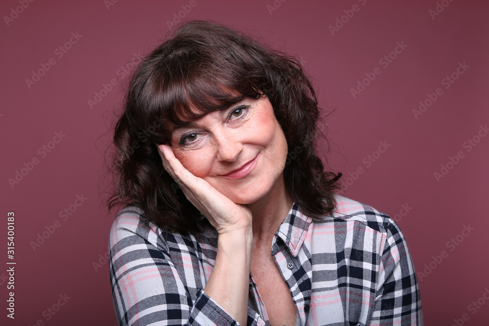 Beautiful woman in front of a background Beautiful woman in front of a background