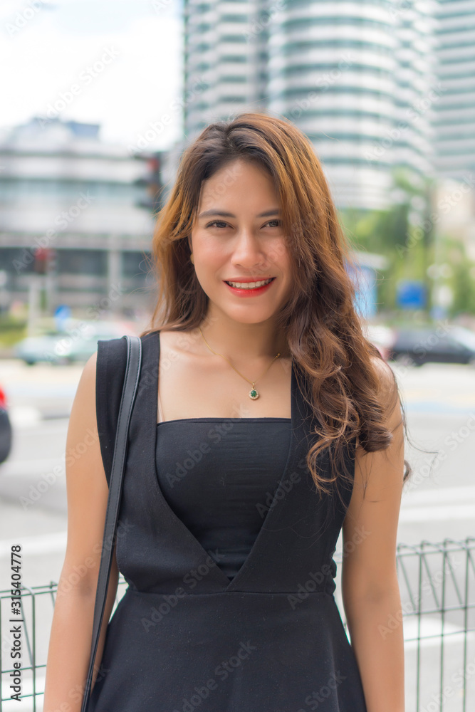 Portrait of Cute Malay Asian Lady outdoor looking at the camera Portrait of Cute Malay Asian Lady outdoor looking at the camera