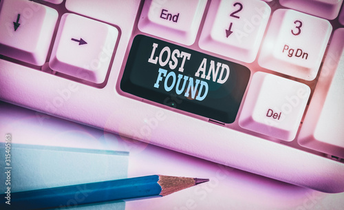 Text sign showing Lost And Found. Business photo showcasing Place where you can find forgotten things Search service White pc keyboard with empty note paper above white background key copy space photo