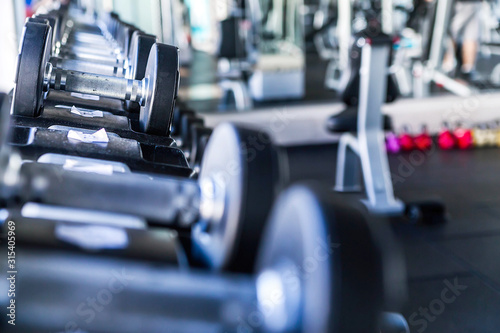 Sports dumbbells in modern sports club. Weight Training Equipment