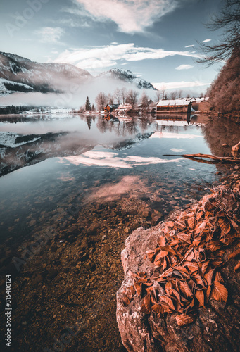 Winter landscape with lake and reflection at the Grundlsee in Austria
