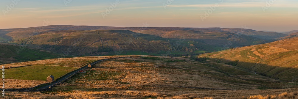 Golden hour over the Swaledale and Black Hill, seen from the Buttertubs Pass (Cliff Gate Rd) near Thwaite, North Yorkshire, England, UK