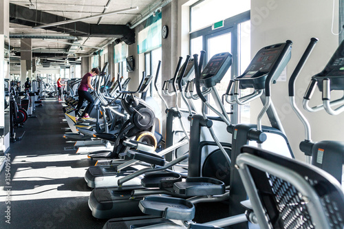 Konstfotografi A number of cardio exercise machines - ellipsoids in a fitness center