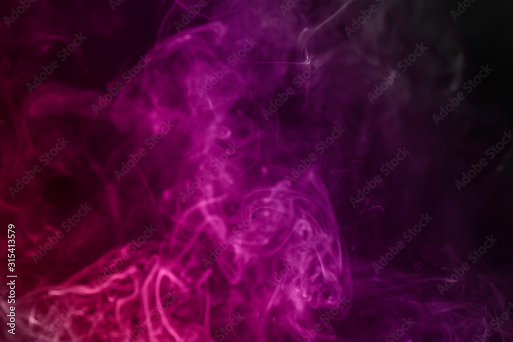 Fototapeta premium colorful smoke on dark background.abstract background from smoke