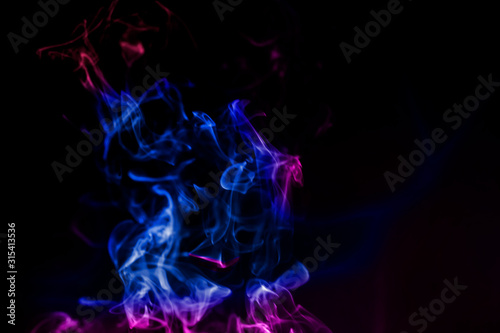 colorful smoke on dark background.abstract background from smoke