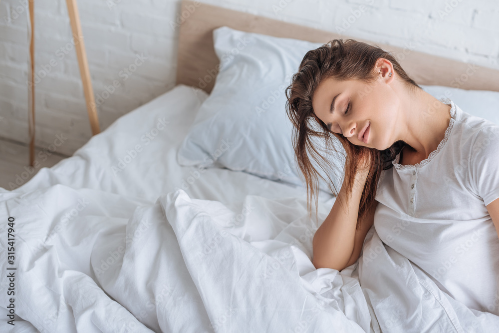 dreamy woman with closed eyes resting in bed dreamy woman with closed eyes resting in bed