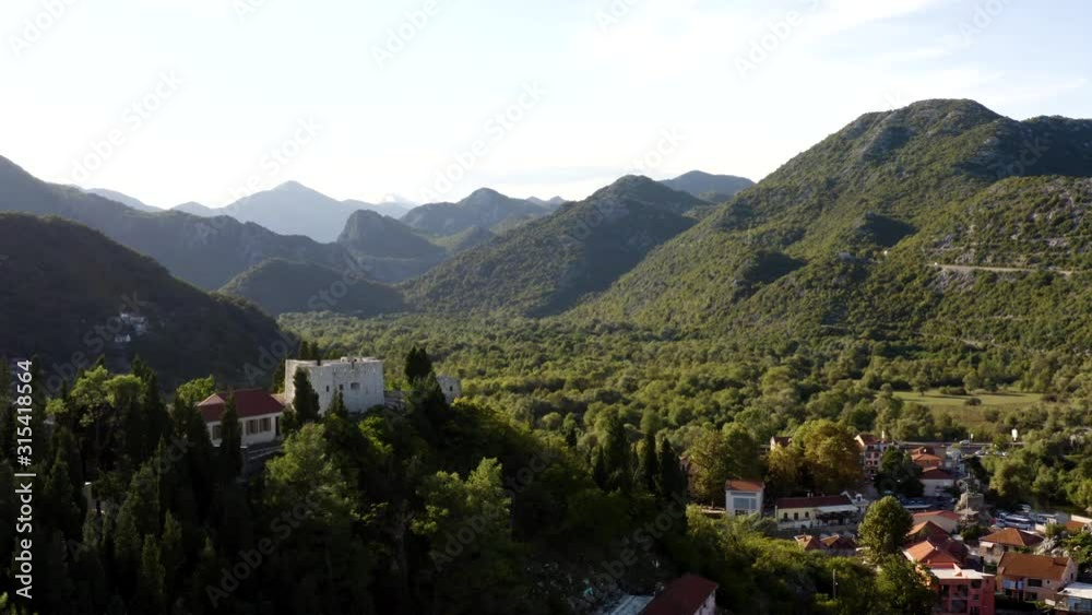 the amazing white Castle of Virpazar in a Three hundred and sixty aerial shot in National Park Lake Skadar Montenegro (drone) the amazing white Castle of Virpazar in a Three hundred and sixty aerial shot in National Park Lake Skadar Montenegro (drone)