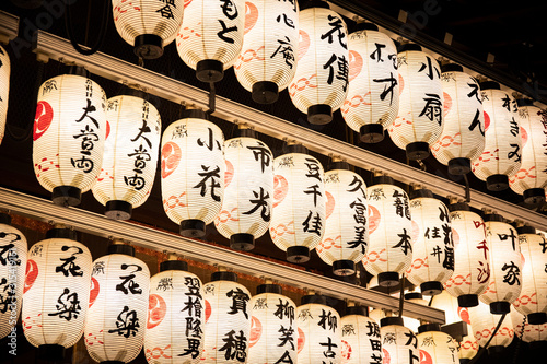 Japan,?Kyoto?Prefecture,?Kyoto?City,?Rows of lanterns glowing in Japanese temple?at night