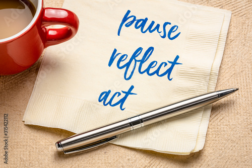 pause, reflect, act concept - words on napkin photo